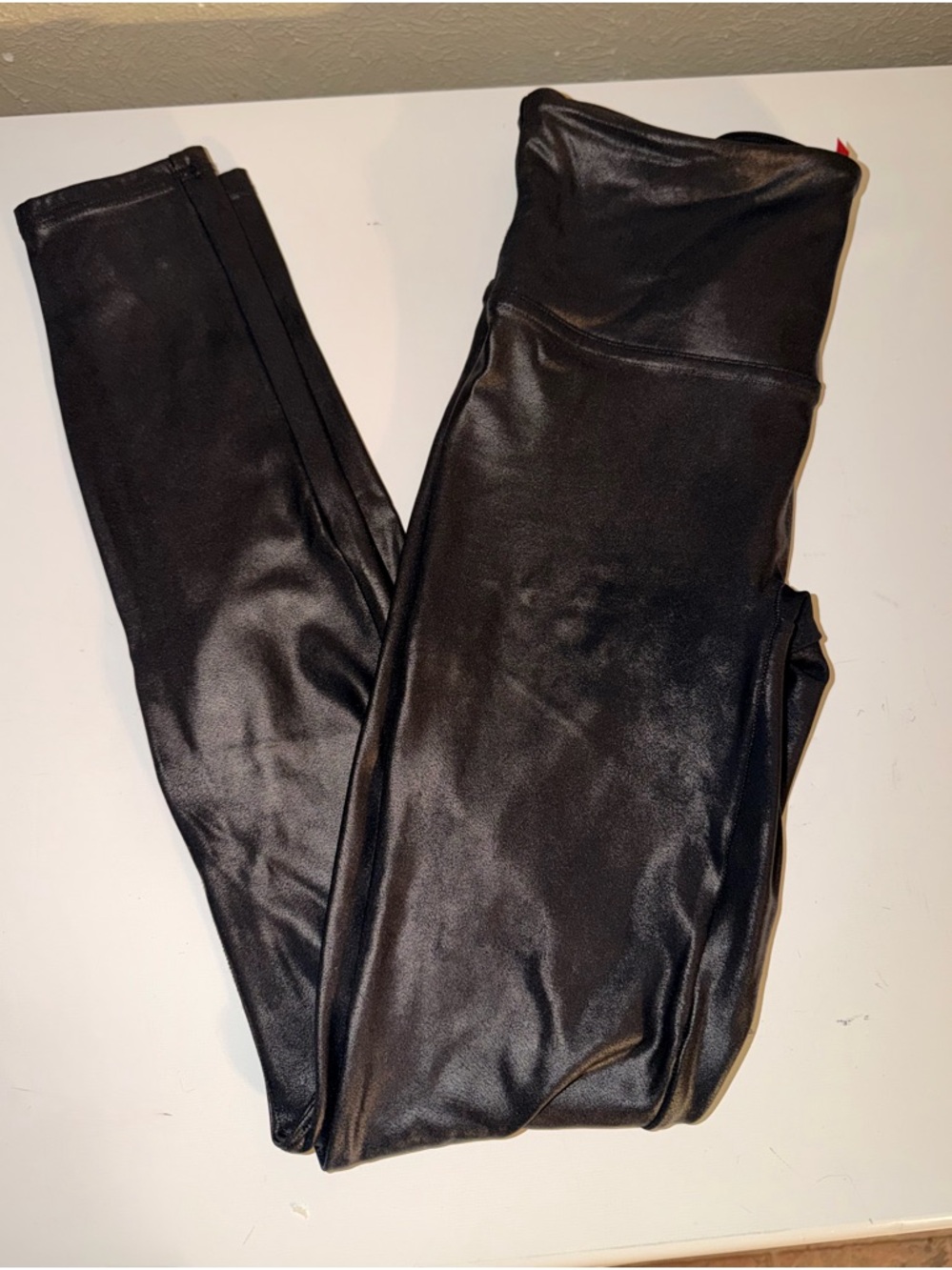 Spanx slimming, butt enhancing leggings with a shiny touch